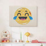 Finished Happy Tears Face punch needle canvas on a wall