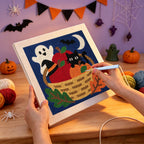 Punching the Harvest Basket Cat design with the punch needle