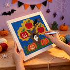 Punching the Haunted Apple Tree design with the punch needle
