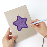 Punching a Heart Candy Mix mini canvas with the punch needle