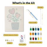 What is in the Heart Flower Pot kit: printed canvas, punch needle, threader, threads, color guide and hangers