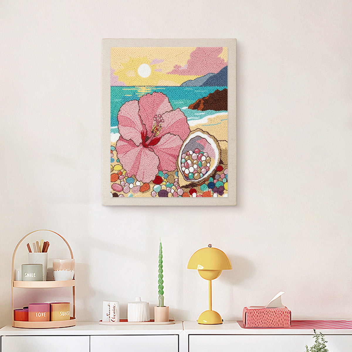 Finished Hibiscus Beach punch needle canvas on a wall