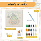 What is in the Hocus Pocus Frog kit: printed canvas, punch needle, threader, threads, color guide and hangers