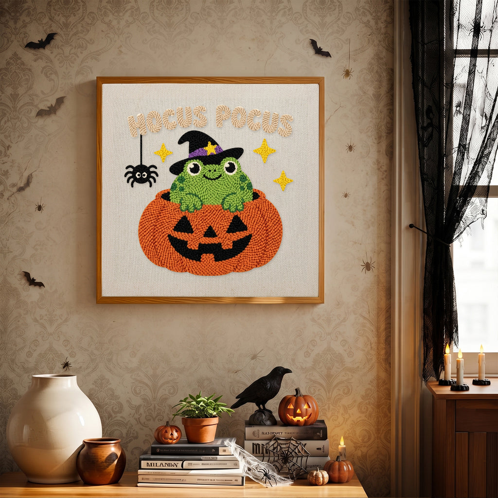 Finished Hocus Pocus Frog punch needle canvas on a wall