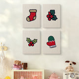 The four Holly and Mitten mini canvases on a wall above a shelf