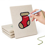 Hand punching one of the Holly and Mitten mini canvases