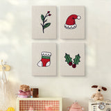 The four Holly and Sprig mini canvases on a wall above a shelf