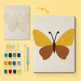Honey Brown Butterfly canvas before and after punching, with the threads and tools