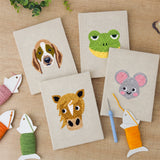 The four finished Horse and Frog mini canvases laid out on a table