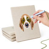 Hand punching one of the Horse and Frog mini canvases