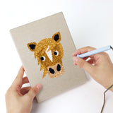 Punching a Horse and Frog mini canvas with the punch needle