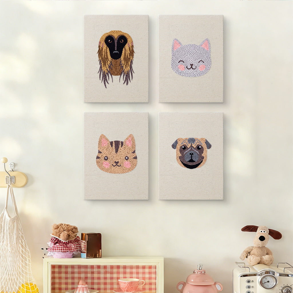 The four Hound and Kittens mini canvases on a wall above a shelf