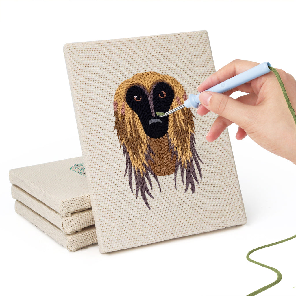 Hand punching one of the Hound and Kittens mini canvases
