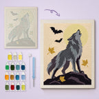 Howling Gray Wolf canvas before and after punching, with the threads and tools