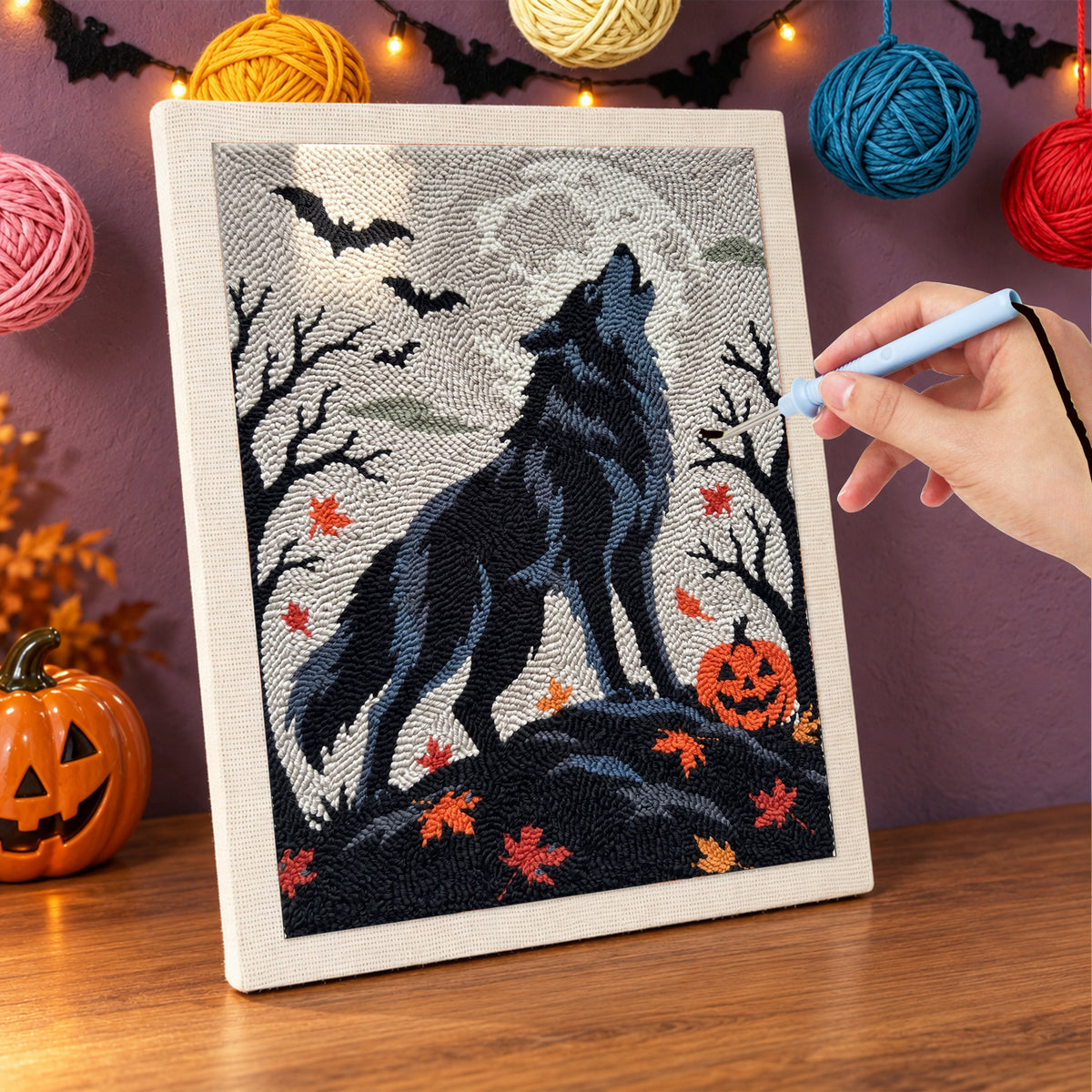 Punching the Howling Wolf design with the punch needle