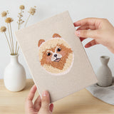 Hand holding a finished Husky and Yorkie mini canvas