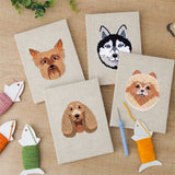 The four finished Husky and Yorkie mini canvases laid out on a table