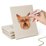 Hand punching one of the Husky and Yorkie mini canvases