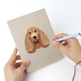 Punching a Husky and Yorkie mini canvas with the punch needle