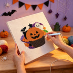 Punching the Jack-o'-Lantern Cupcake design with the punch needle