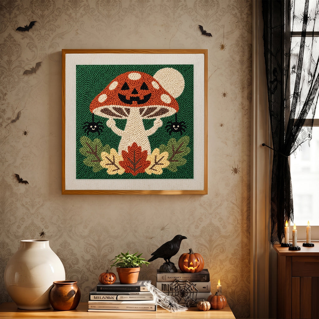 Finished Jack-o'-Lantern Toadstool punch needle canvas on a wall