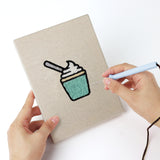 Punching a Jelly Bean Pops mini canvas with the punch needle