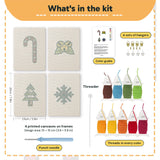 What is in the Jingle Bells Snowflake set: 4 printed canvases, punch needle, threader, threads, color guide and 4 sets of hangers (6 × 8 in (15 × 20 cm) each)