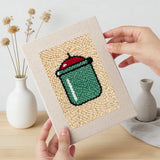 Hand holding a finished Kitchen Favorites mini canvas