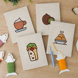 The four finished Kiwi Coffee Break mini canvases laid out on a table