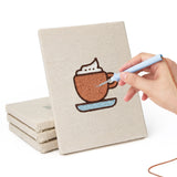 Hand punching one of the Kiwi Coffee Break mini canvases