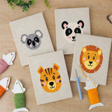The four finished Koala and Panda mini canvases laid out on a table