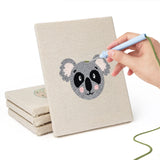 Hand punching one of the Koala and Panda mini canvases