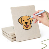 Hand punching one of the Labrador and Shepherd mini canvases