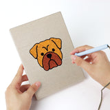 Punching a Labrador and Shepherd mini canvas with the punch needle