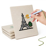 Hand punching one of the Landmark Postcards mini canvases