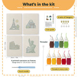 What is in the Landmark Postcards set, 8 × 12 in (20 × 30 cm) each: 4 printed canvases, punch needle, threader, threads, color guide and 4 sets of hangers