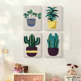 The four Leafy Houseplants mini canvases on a wall above a shelf