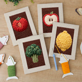 The four finished Lemon and Broccoli mini canvases laid out on a table