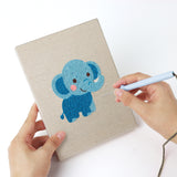 Punching a Lion and Friends mini canvas with the punch needle