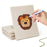 Hand punching one of the Lion and Sheep mini canvases