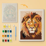 Lion Portrait canvas before and after punching, with the threads and tools
