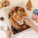 Punching the Lion Portrait design with the punch needle