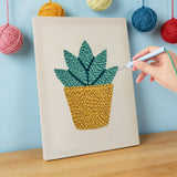 Hand punching the Little Agave design on a framed canvas