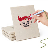 Hand punching one of the Little Devils mini canvases