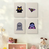 The four Little Vampire mini canvases on a wall above a shelf