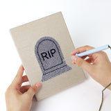 Punching a Little Vampire mini canvas with the punch needle