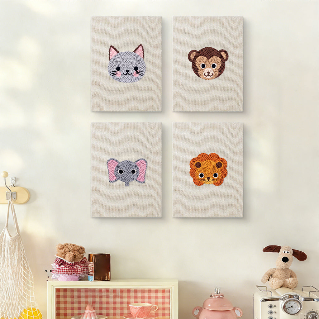 The four Little Zoo Faces mini canvases on a wall above a shelf
