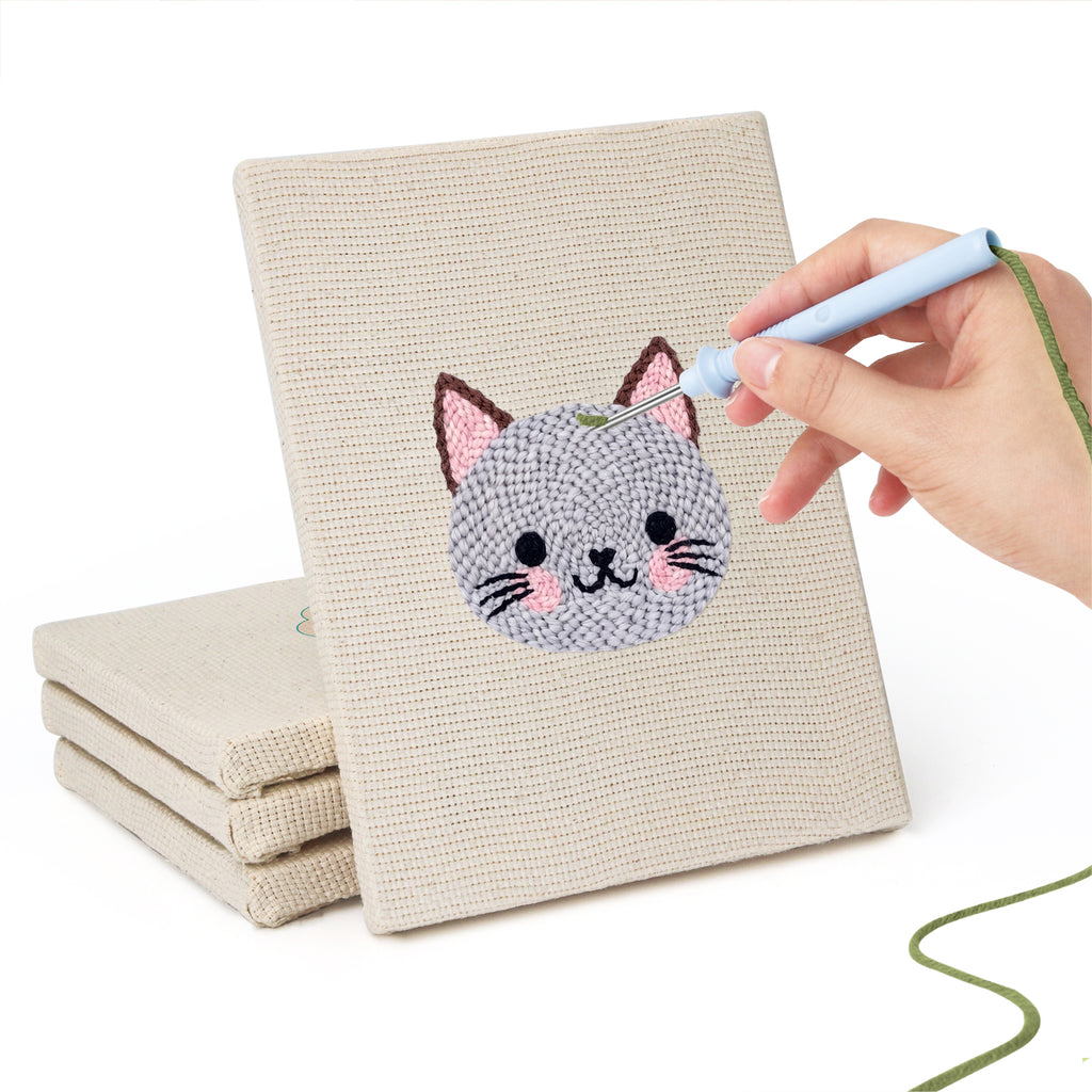 Hand punching one of the Little Zoo Faces mini canvases