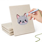 Hand punching one of the Little Zoo Faces mini canvases