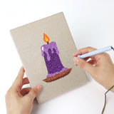 Punching a Lollipop and Bat mini canvas with the punch needle